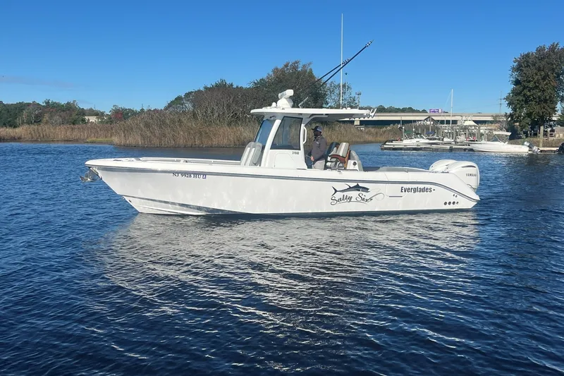 The Image of 2025 Everglades 315 Center Console boat on calm water, side view. - 0