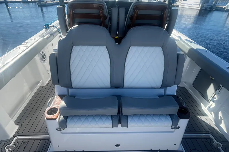 Slide: The Image of 2025 Everglades 315 Center Console boat seating with quilted upholstery and cup holders. - 10