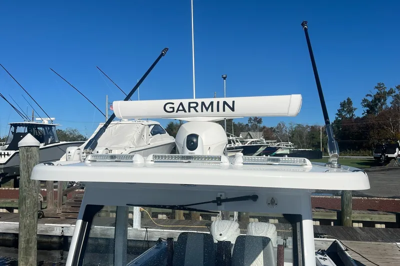 Slide: The Image of 2025 Everglades 315 Center Console boat with Garmin radar at dock. - 11