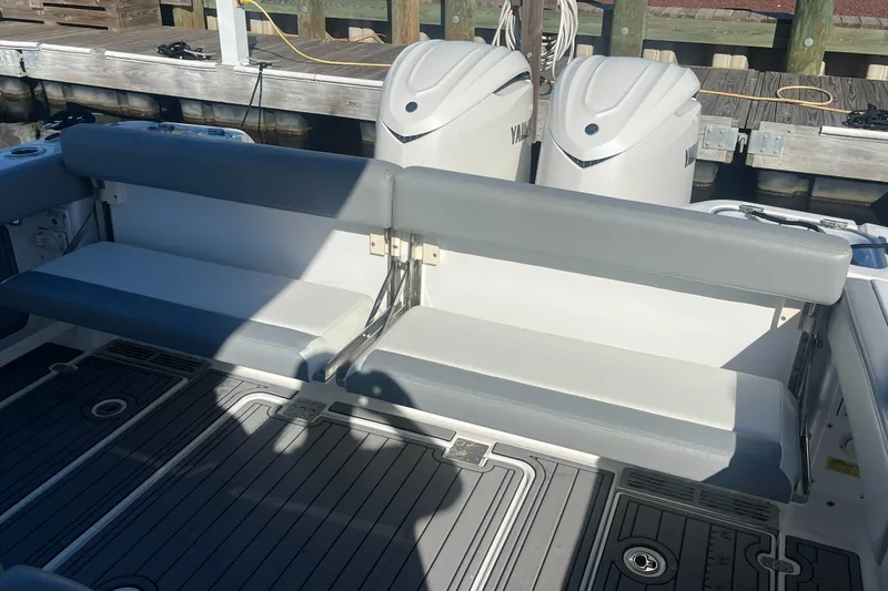 Slide: The Image of 2025 Everglades 315 Center Console boat with dual Yamaha engines and cushioned seating. - 13