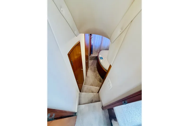Slide: The Image of Interior view of 2001 Carver 444 Cockpit Motor Yacht, featuring stairs and cabin entrance. - 21