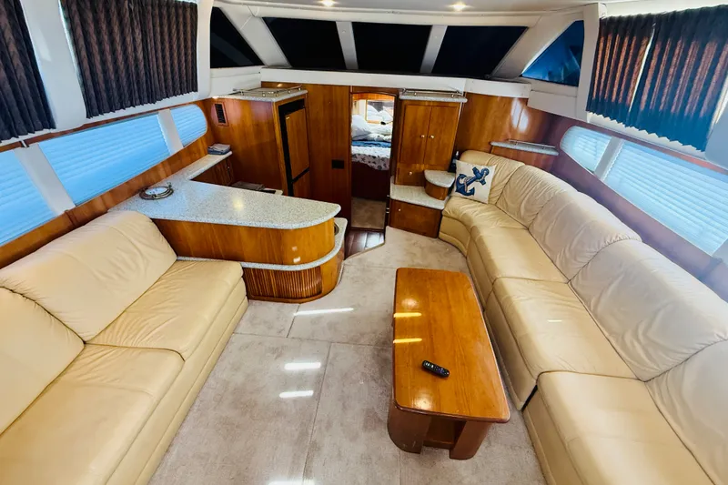 Slide: The Image of Luxurious interior of 2001 Carver 444 Cockpit Motor Yacht with beige leather seating. - 14