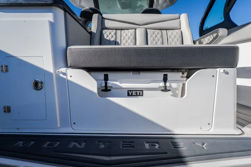 Slide: The Image of Luxury seating on 2026 Monterey Elite 30 OB boat with integrated Yeti cooler. - 35