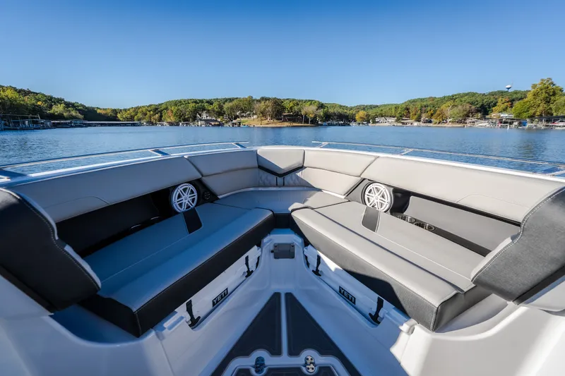 Slide: The Image of Luxurious seating on the 2026 Monterey Elite 30 OB boat, with scenic lake view. - 48