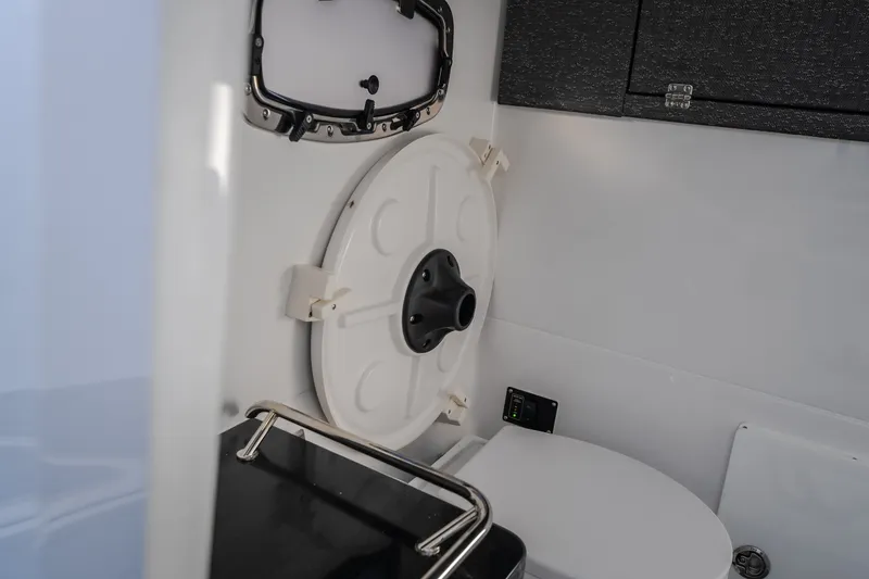 Slide: The Image of 2026 Monterey Elite 30 OB boat interior with modern bathroom amenities. - 55