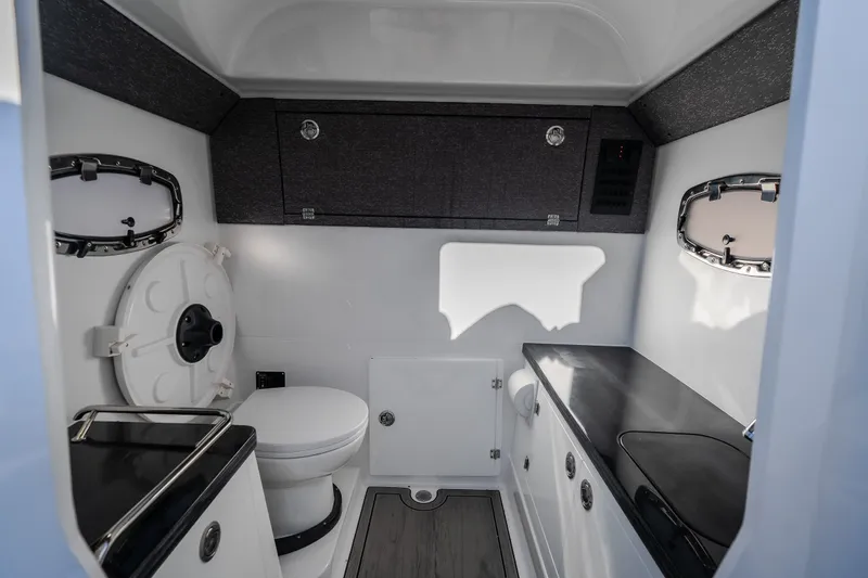 Slide: The Image of 2026 Monterey Elite 30 OB boat interior bathroom with modern fixtures and sleek design. - 54