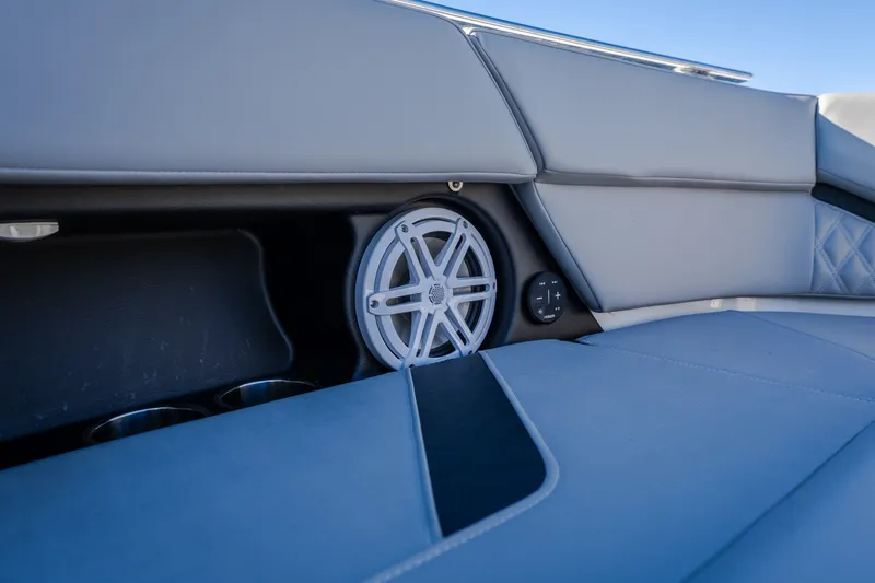 Slide: The Image of Interior of 2026 Monterey Elite 30 OB boat with speaker and cup holders. - 50
