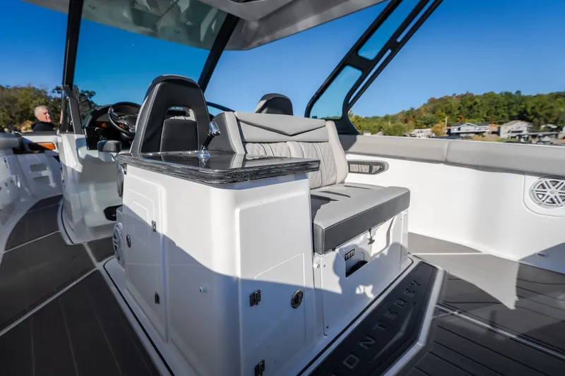 Slide: The Image of Luxurious interior of 2026 Monterey Elite 30 OB boat with sleek seating and modern design. - 39