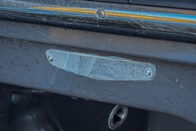 Slide: The Image of Close-up of a metal plate on a 2026 Monterey Elite 30 OB boat. - 79