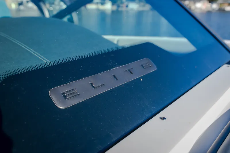 Slide: The Image of 2026 Monterey Elite 30 OB boat dashboard with "Elite" emblem. - 56