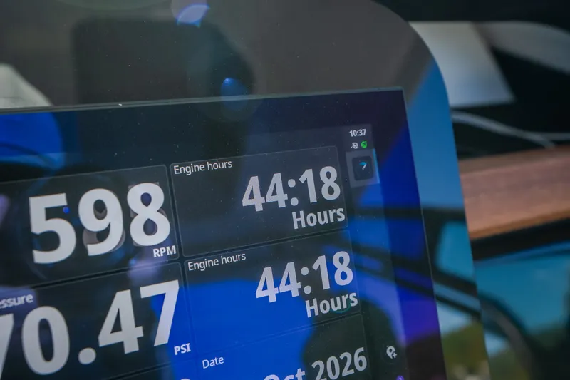 Slide: The Image of Close-up of a 2026 Monterey Elite 30 OB dashboard displaying engine hours and RPM. - 23