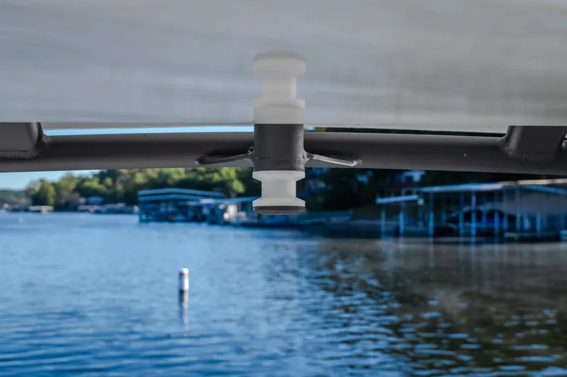 Slide: The Image of Close-up of a Monterey Elite 30 OB boat component with a lake view in the background. - 61