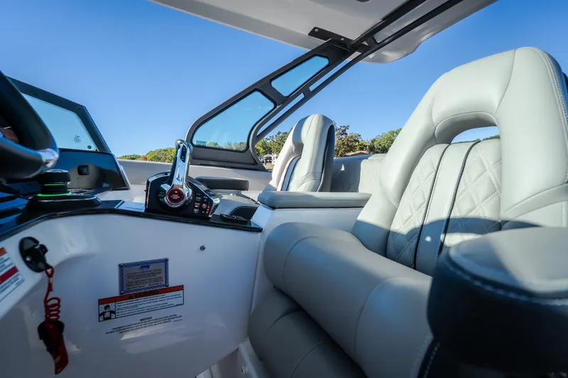 Slide: The Image of Luxurious interior of 2026 Monterey Elite 30 OB boat with plush seating and modern controls. - 24