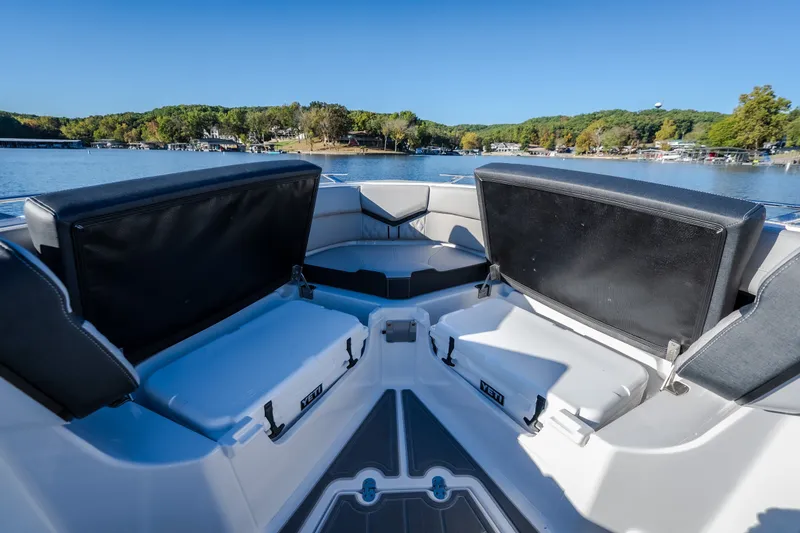 Slide: The Image of Interior view of 2026 Monterey Elite 30 OB boat with seating and storage. - 49