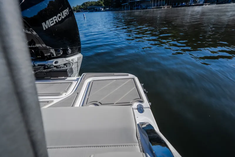 Slide: The Image of 2026 Monterey Elite 30 OB boat with Mercury engine on calm water. - 63