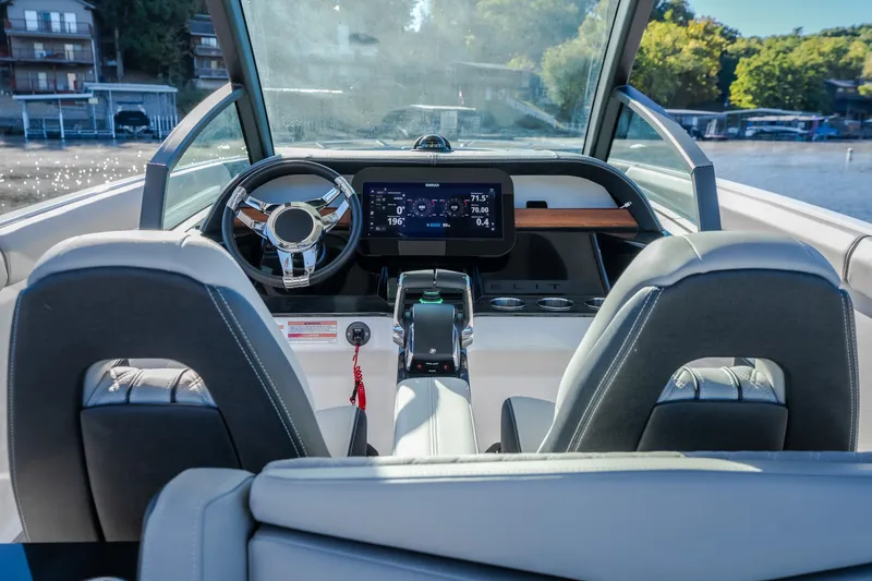 Slide: The Image of Interior view of 2026 Monterey Elite 30 OB boat cockpit with modern controls. - 14