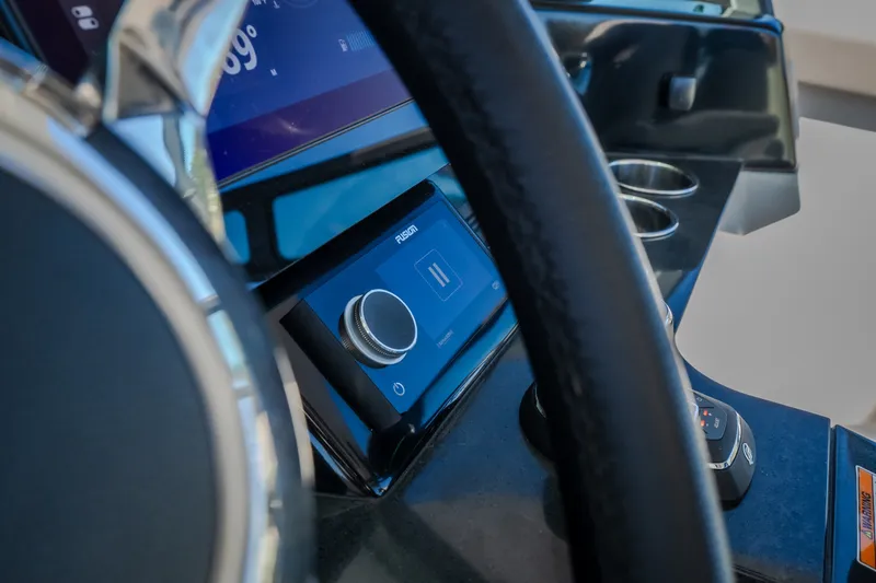 Slide: The Image of Dashboard of 2026 Monterey Elite 30 OB boat with modern controls and display. - 20