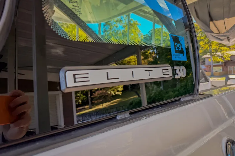 Slide: The Image of 2026 Monterey Elite 30 OB boat window with logo and Missouri registration sticker. - 74