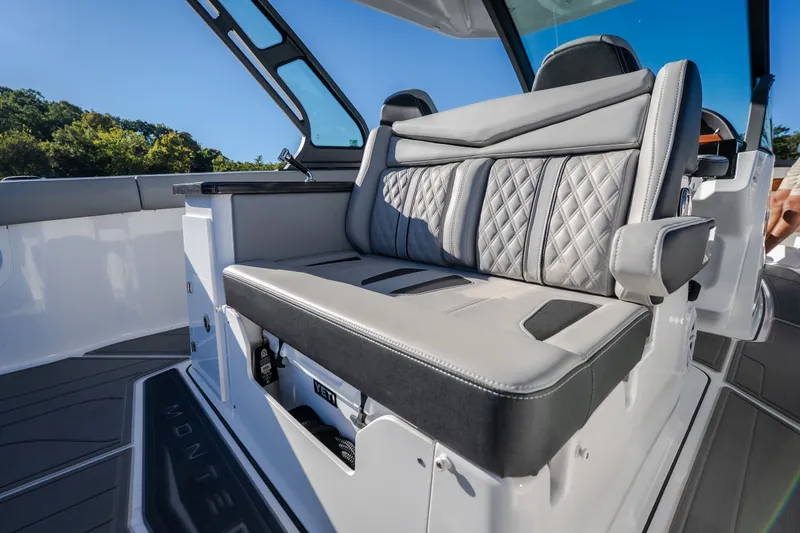Slide: The Image of Luxurious seating on 2026 Monterey Elite 30 OB boat, featuring elegant diamond-stitched upholstery. - 34