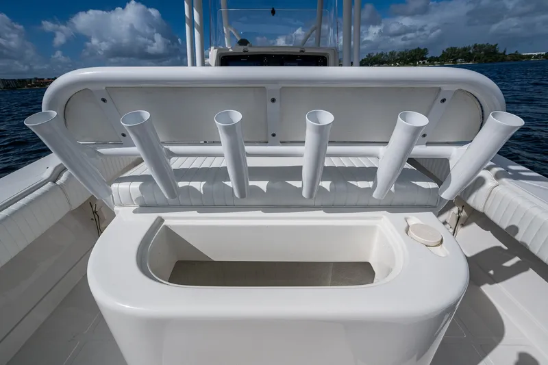 Slide: The Image of 2004 Jupiter 31 Cuddy boat with rod holders and storage compartment on deck. - 13