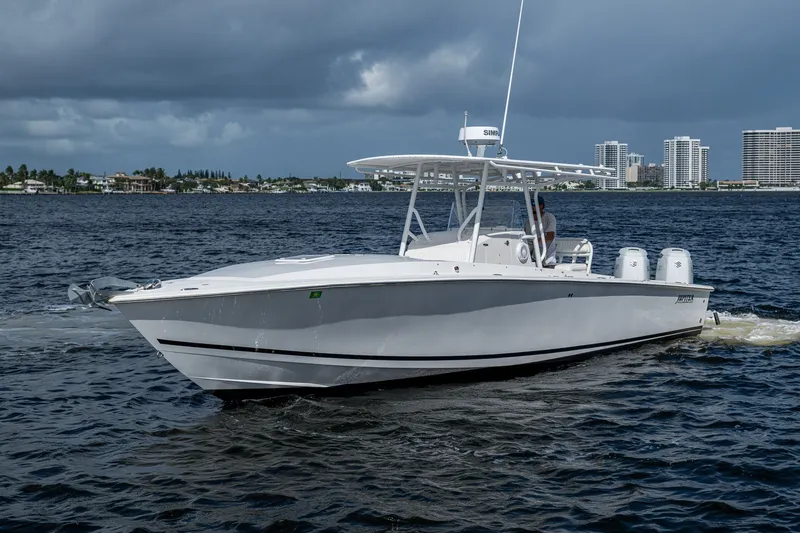 Slide: The Image of 2004 Jupiter 31 Cuddy boat cruising on a calm, cloudy day. - 18