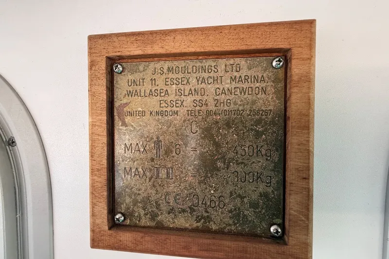 Slide: The Image of Plaque on Mitchell Sea Angler 2002, detailing weight limits and manufacturer information. - 19
