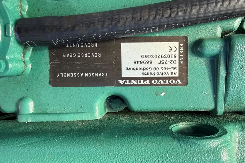 Slide: The Image of Green Volvo Penta engine component with label, part of Mitchell Sea Angler 2002 model. - 18