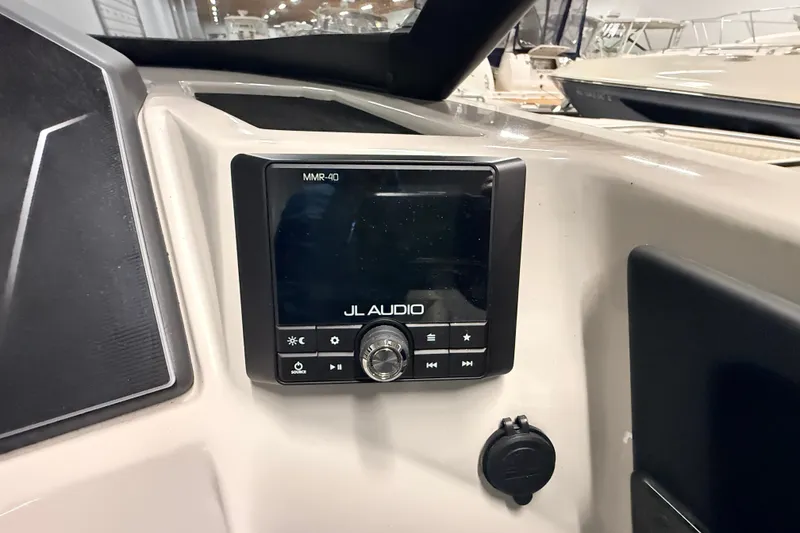 Slide: The Image of Control panel of 2025 Sylvan G3 CLZ DC boat featuring JL Audio system. - 23