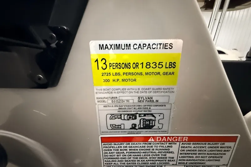Slide: The Image of Capacity label on 2025 Sylvan G3 CLZ DC boat, 13 persons or 1835 lbs. - 13
