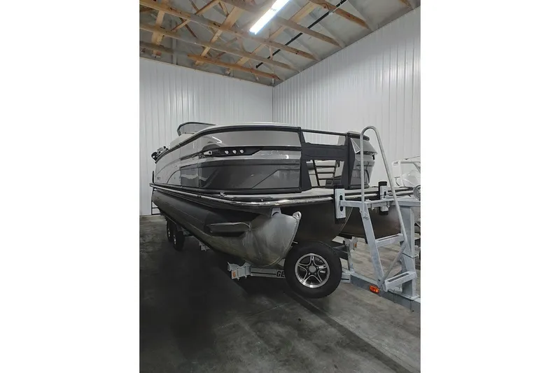 Slide: The Image of 2025 Sylvan G3 CLZ DC boat on trailer in indoor storage facility. - 3