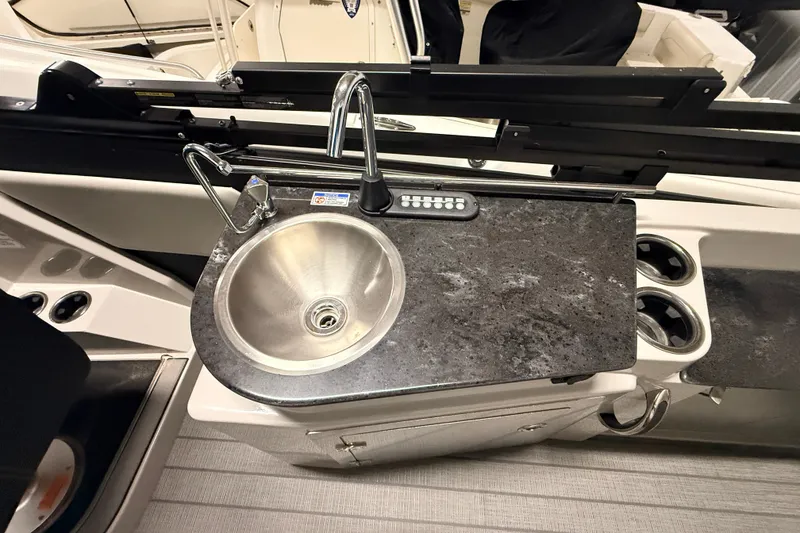 Slide: The Image of 2025 Sylvan G3 CLZ DC boat sink with countertop and cup holders. - 26