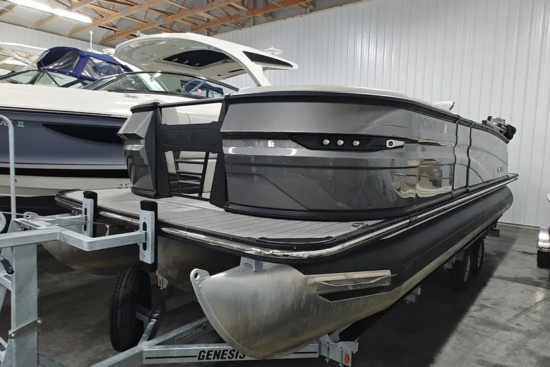 Slide: The Image of 2025 Sylvan G3 CLZ DC pontoon boat in storage, showcasing sleek design and modern features. - 4