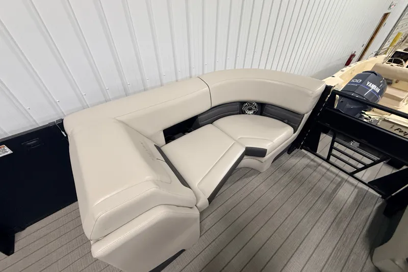 Slide: The Image of 2025 Sylvan G3 CLZ DC boat interior with beige seating and Yamaha motor. - 10