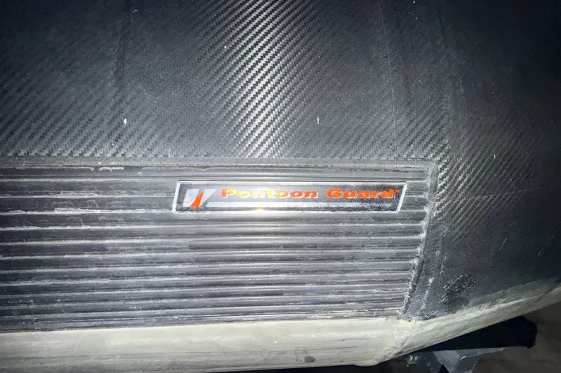 Slide: The Image of Close-up of 2025 Sylvan G3 CLZ DC Pontoon Guard with carbon fiber texture. - 30