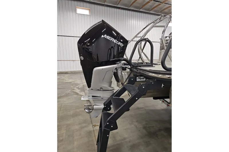 Slide: The Image of 2025 Sylvan G3 CLZ DC boat with Mercury outboard motor in a garage. - 5