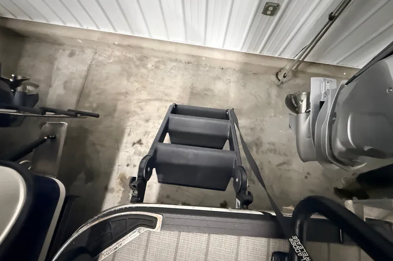 Slide: The Image of Top view of a 2025 Sylvan G3 CLZ DC boat ladder in a garage setting. - 17
