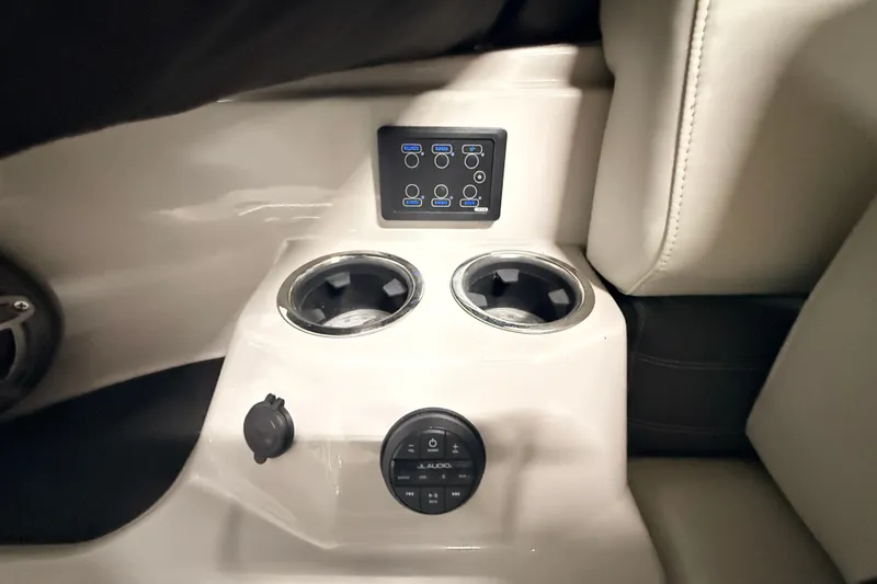 Slide: The Image of Interior of 2025 Sylvan G3 CLZ DC featuring cup holders and control panel. - 16