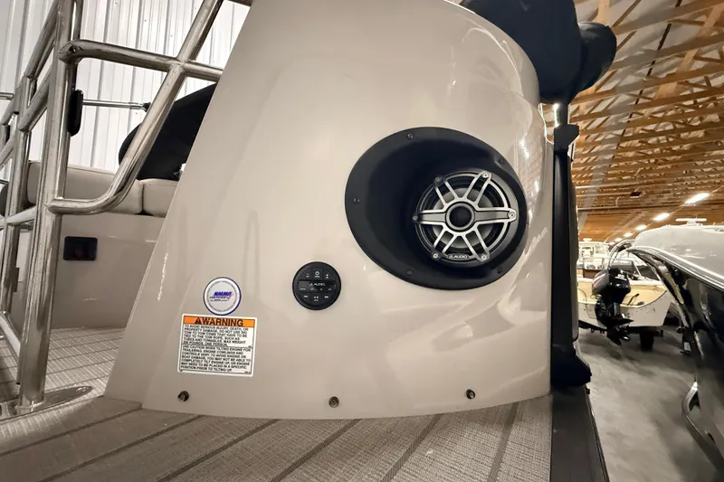 Slide: The Image of 2025 Sylvan G3 CLZ DC boat speaker and control panel in a showroom. - 25