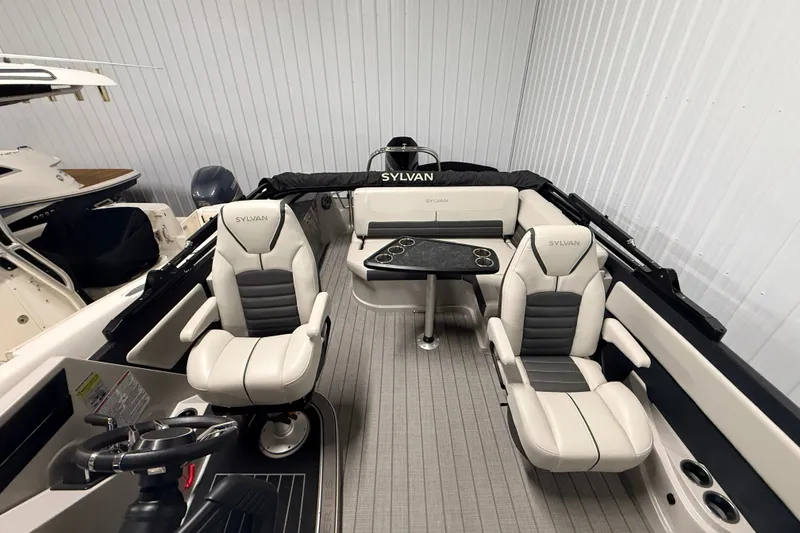 Slide: The Image of 2025 Sylvan G3 CLZ DC boat interior with plush seating and sleek design. - 11