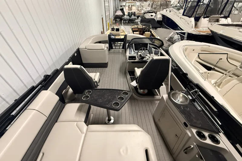 Slide: The Image of Interior of 2025 Sylvan G3 CLZ DC boat with seating, steering console, and amenities. - 21