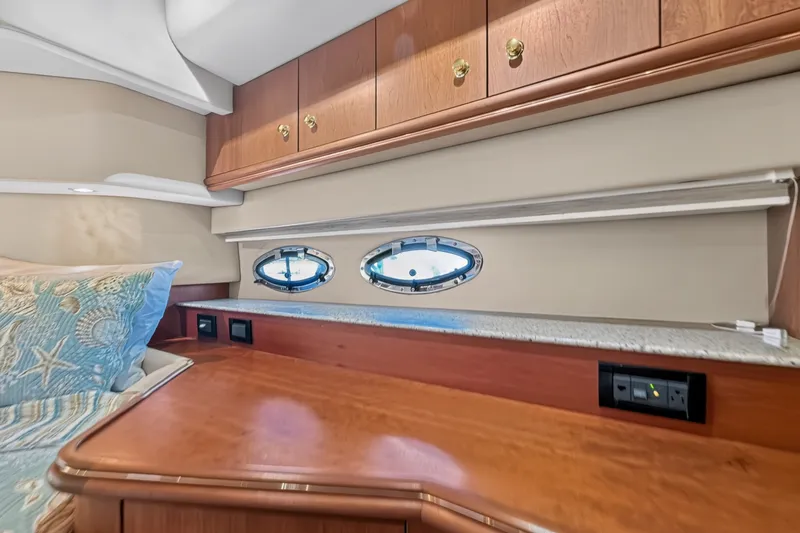 Slide: The Image of Luxurious cabin interior of 2003 Cruisers Yachts 4450 Express Motoryacht with wood cabinetry. - 55