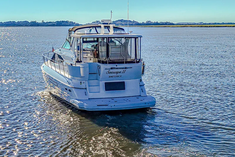 Slide: The Image of 2003 Cruisers Yachts 4450 Express Motoryacht cruising on a sunny day. - 5