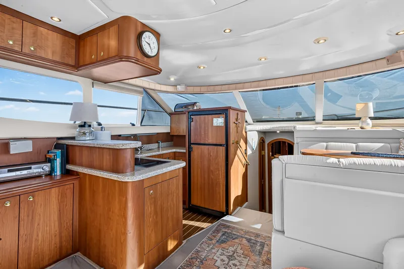 Slide: The Image of Luxurious interior of 2003 Cruisers Yachts 4450 Express Motoryacht with elegant wood finishes. - 35