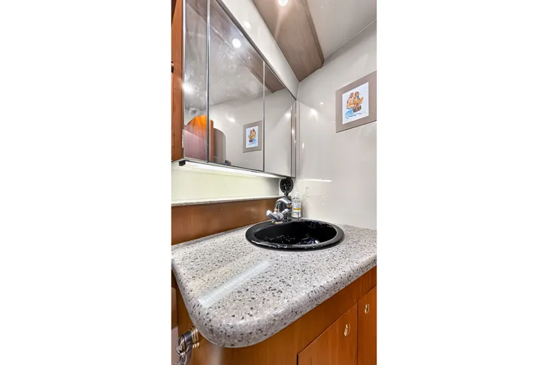 Slide: The Image of Luxurious bathroom vanity in 2003 Cruisers Yachts 4450 Express Motoryacht. - 41