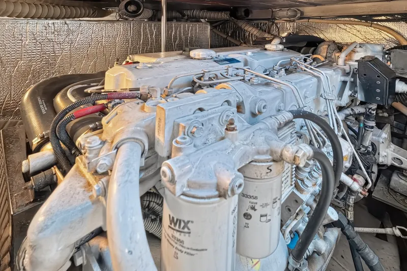 Slide: The Image of Engine compartment of 2003 Cruisers Yachts 4450 Express Motoryacht with visible components and wiring. - 65