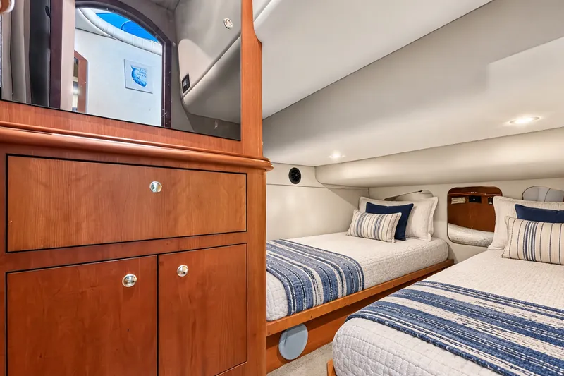 Slide: The Image of Luxurious cabin interior of 2003 Cruisers Yachts 4450 Express Motoryacht with twin beds. - 45
