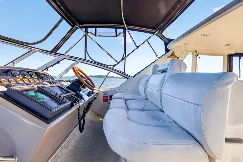 Slide: The Image of Interior of 2003 Cruisers Yachts 4450 Express Motoryacht with helm and seating. - 17