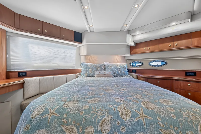 Slide: The Image of Luxurious bedroom interior of 2003 Cruisers Yachts 4450 Express Motoryacht with elegant bedding. - 43