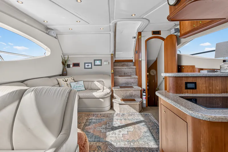 Slide: The Image of Luxurious interior of 2003 Cruisers Yachts 4450 Express Motoryacht with elegant seating and modern amenities. - 29