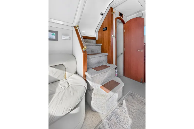 Slide: The Image of Interior of 2003 Cruisers Yachts 4450 Express Motoryacht with stairs and seating area. - 39